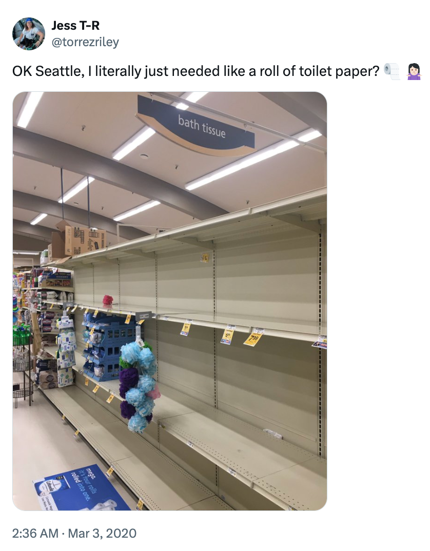 Empty toilet paper shelves in a store, with a person expressing disbelief in a tweet