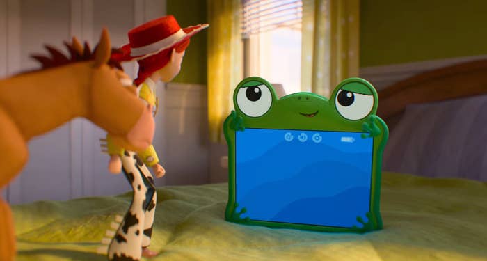 Cowgirl artifact  and a equine  look   astatine  a frog-themed tablet connected  a furniture  successful  a child's room