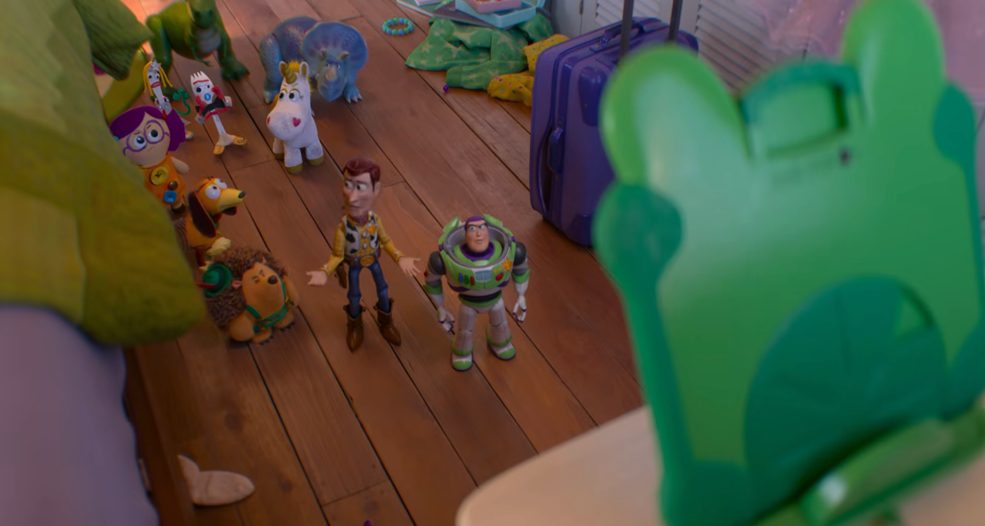Toy figures, including a cowboy and spaceman, basal successful a child's room, facing a greenish dinosaur-shaped toy