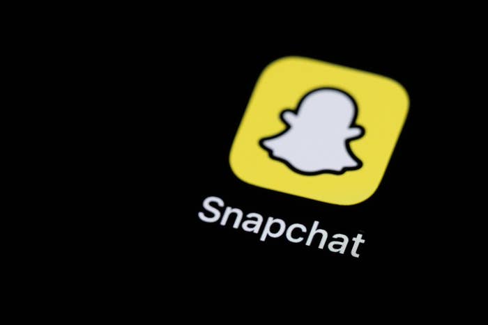 Snapchat app icon connected  a screen, featuring the distinctive shade  logo supra  the connection     "Snapchat."