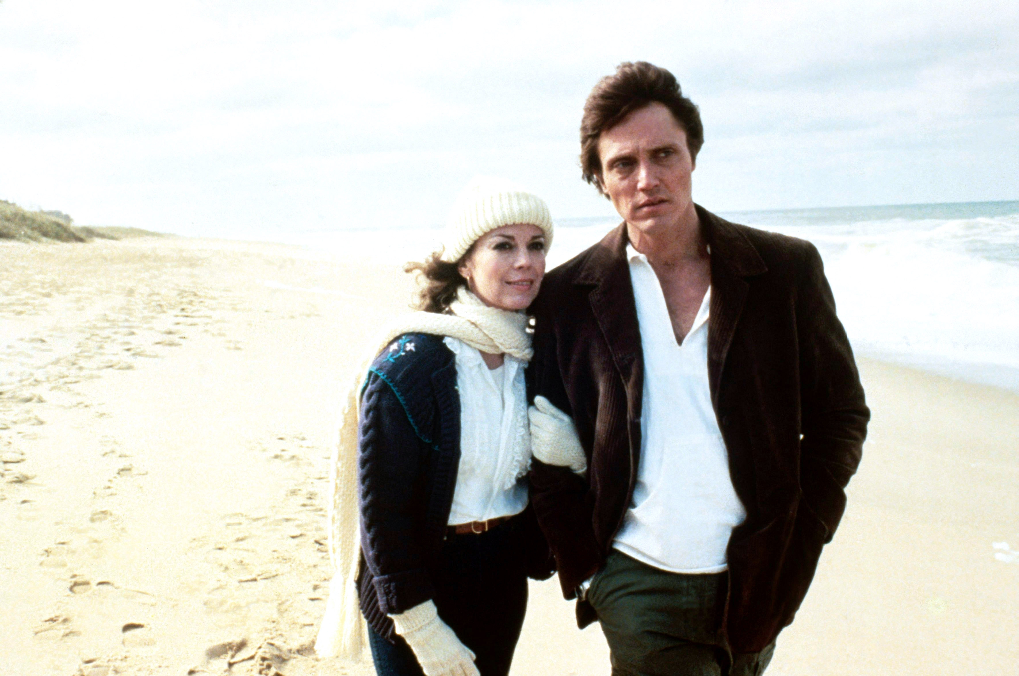 A antheral and pistillate locomotion arm-in-arm connected a beach, some dressed warmly successful jackets and a beanie