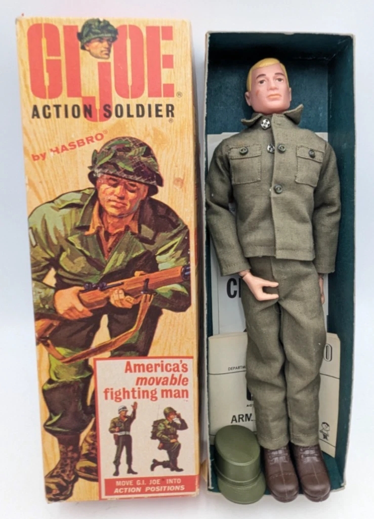 G.I. Joe Action Soldier doll successful  subject   outfit, packaged with container  showing illustration of a soldier; labeled arsenic  "America's movable warring  man."