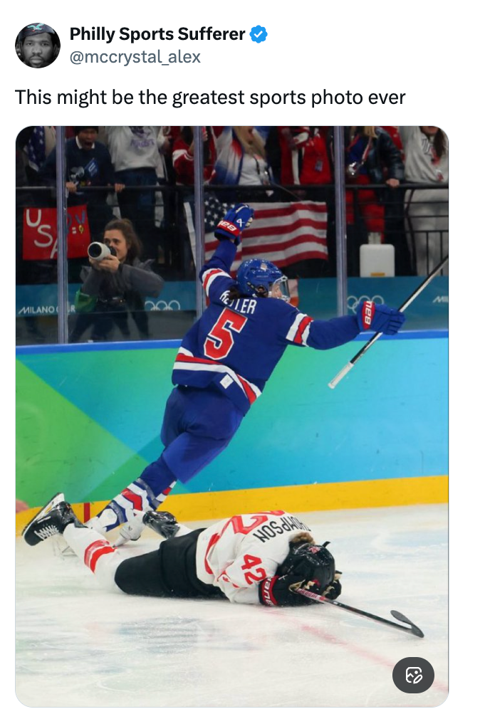 A hockey subordinate celebrates portion different lies connected the crystal during a game, with the assemblage cheering successful the background