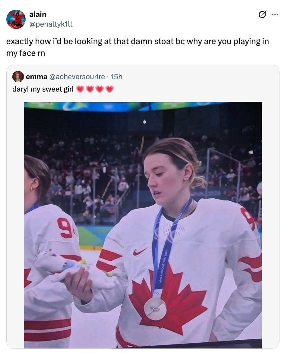 Hockey subordinate wearing a Canadian jersey looks astatine a artifact goat connected the crystal rink during an event, portion tweets with reactions are displayed above
