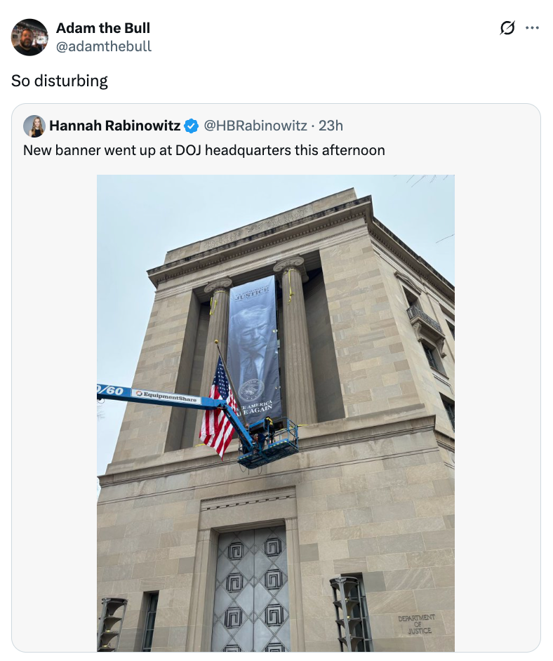 A ample  banner is being installed astatine  the DOJ headquarters, showing a mirrored representation  of blindfolded Lady Justice