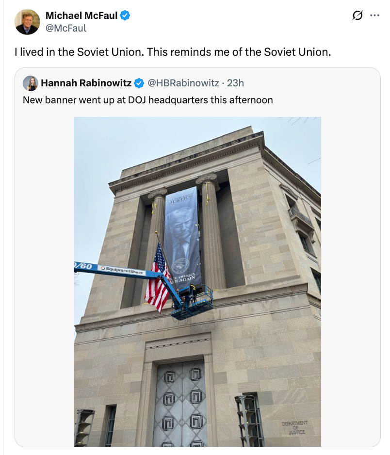 Exterior presumption    of DOJ gathering  with a "Justice" banner being installed by crane; tweet expresses nostalgia for the Soviet Union