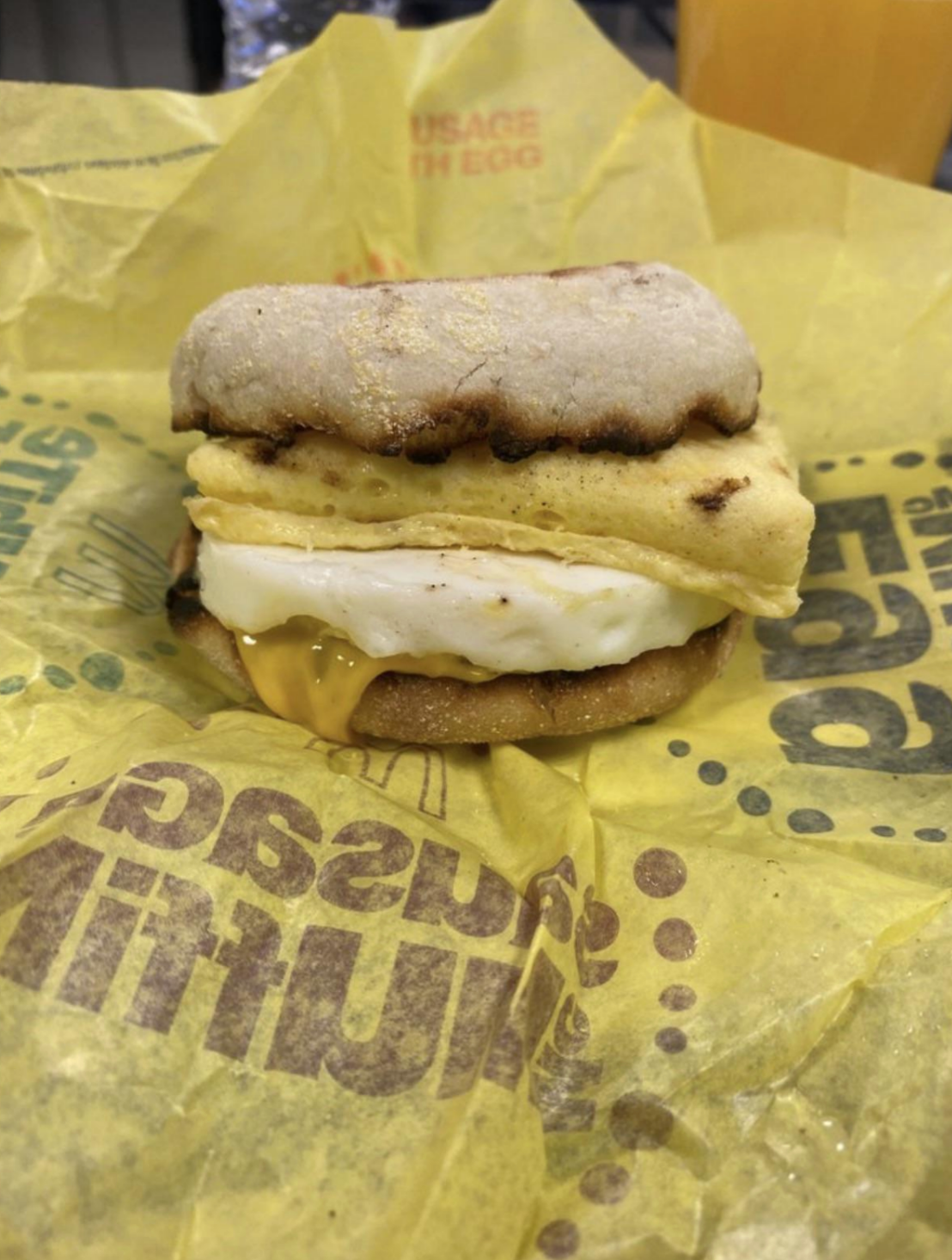 Egg sandwich with cheese, a fried egg, and folded egg