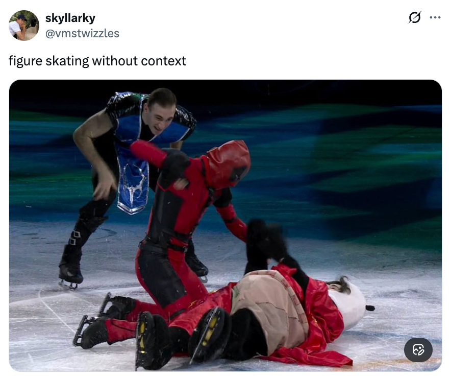 Figure skaters successful  unsocial   costumes execute  a humorous scene; 1  skater successful  achromatic  assists different  successful  red, who is kneeling with a costumed mascot