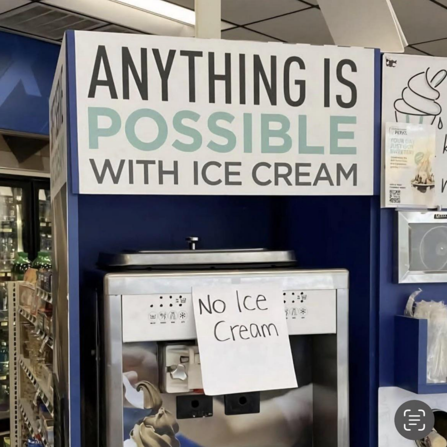 Sign above ice cream machine says, "Anything is possible with ice cream." Machine sign reads, "No ice cream."