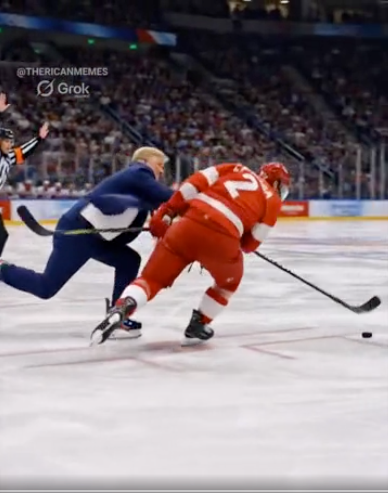 En hockeyspiller i rødt, forfulgt av en annen i blått, skøyter på en skøytebane under en kamp. En offisiell signaliserer bak dem