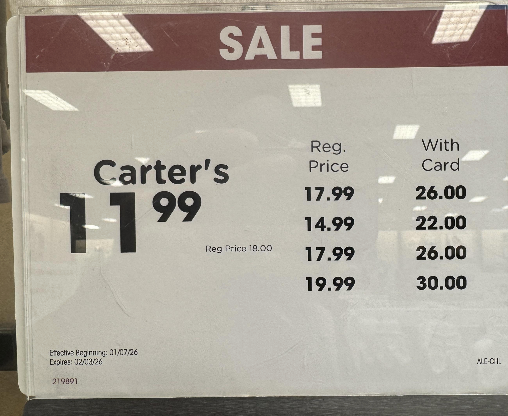 Sale sign showing four discounted prices with and without card savings; the card prices are way more than the regular and sale price