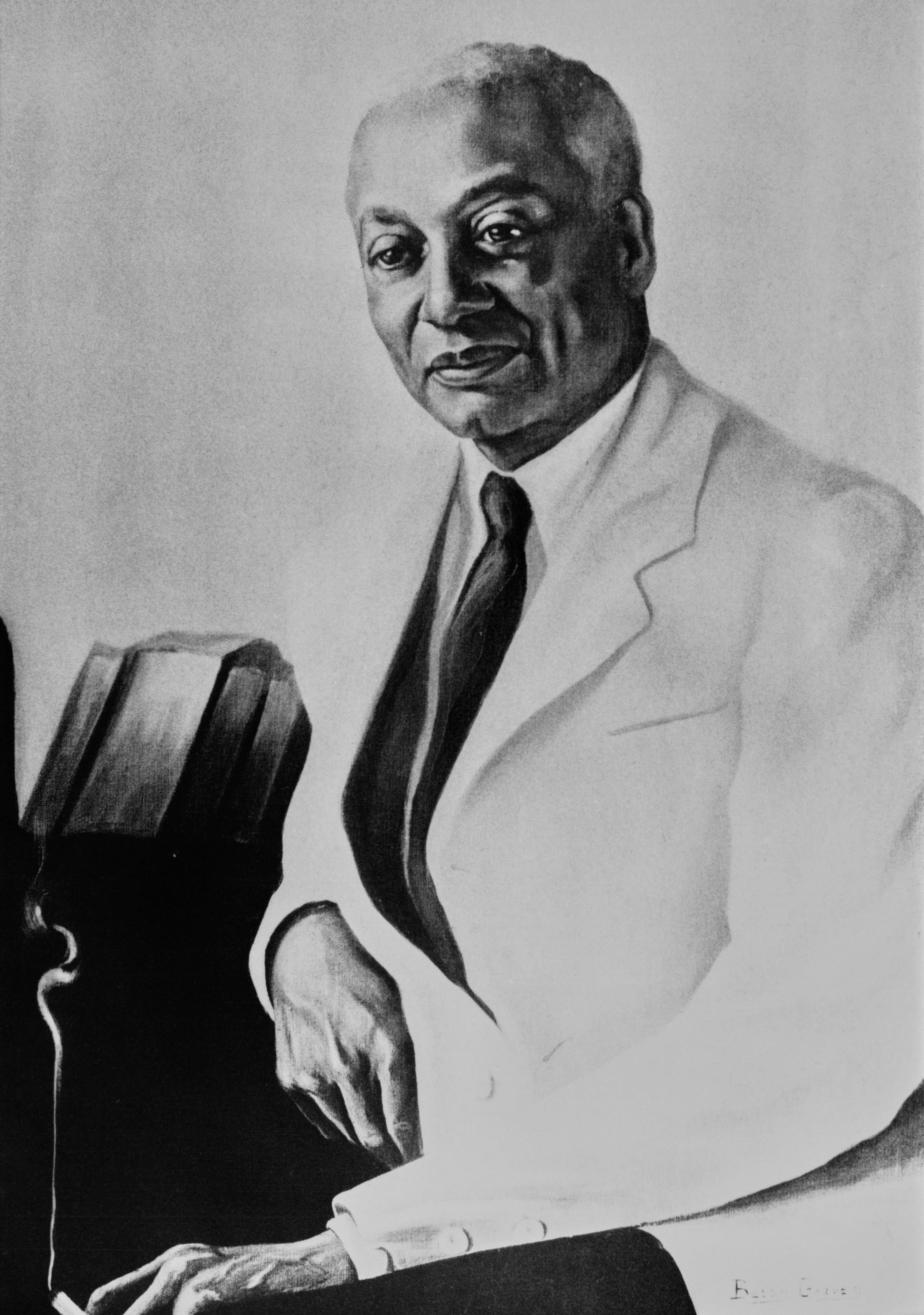 Portrait of a distinguished idiosyncratic   successful  a suit, with a assured  expression, posing with manus  resting connected  a book