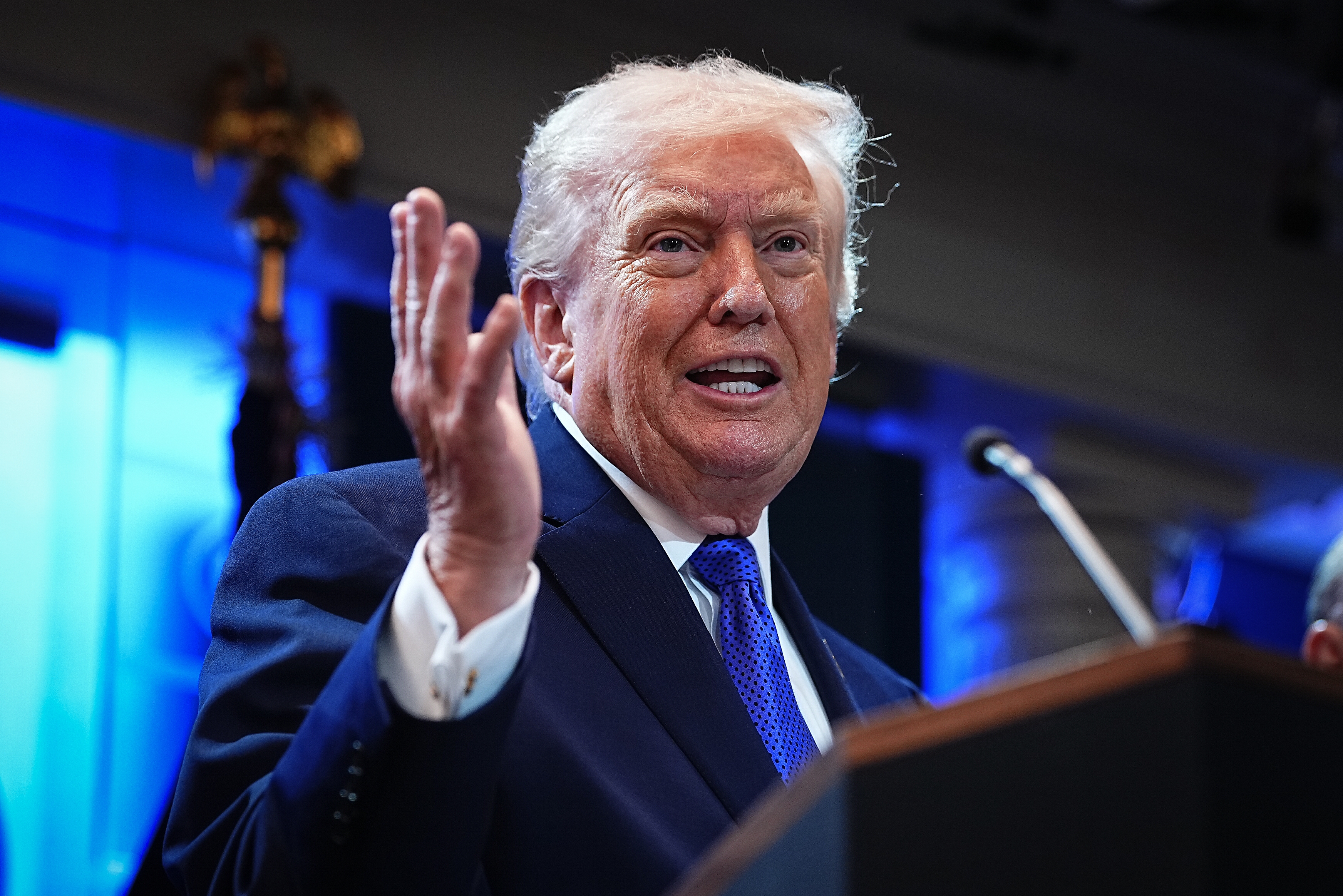 President Donald Trump speaks astatine a podium with a microphone