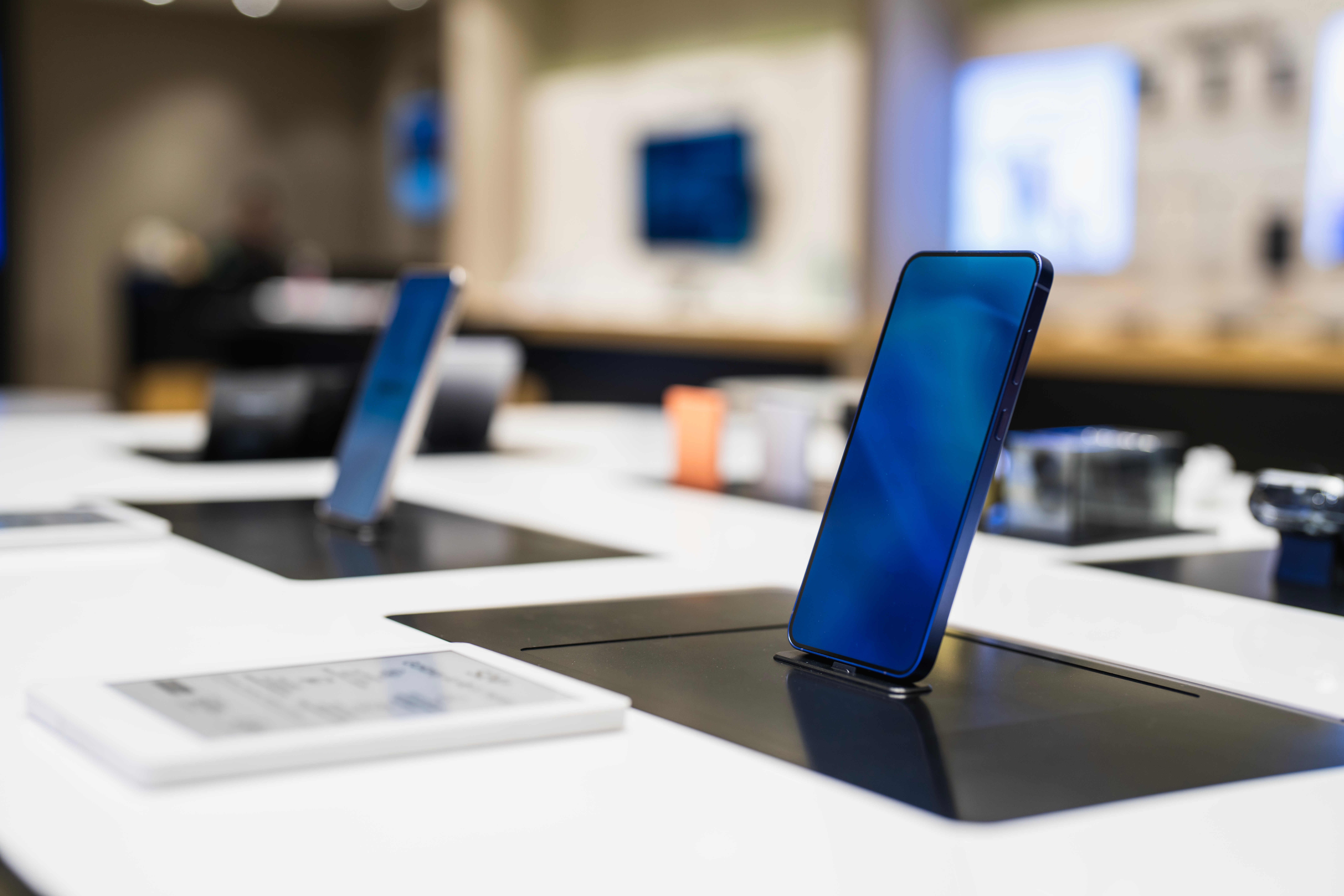 Smartphones displayed connected stands successful an electronics store