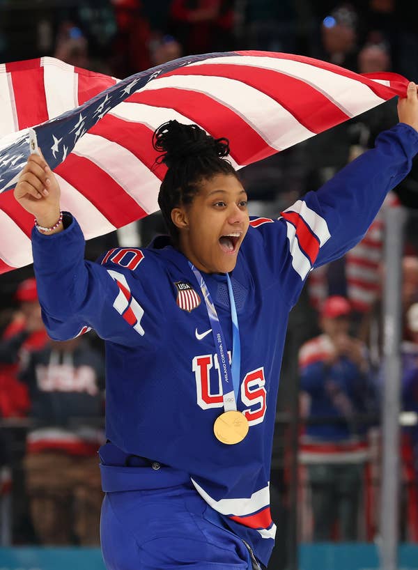 Laila Edwards celebrating with a gold medal around her neck
