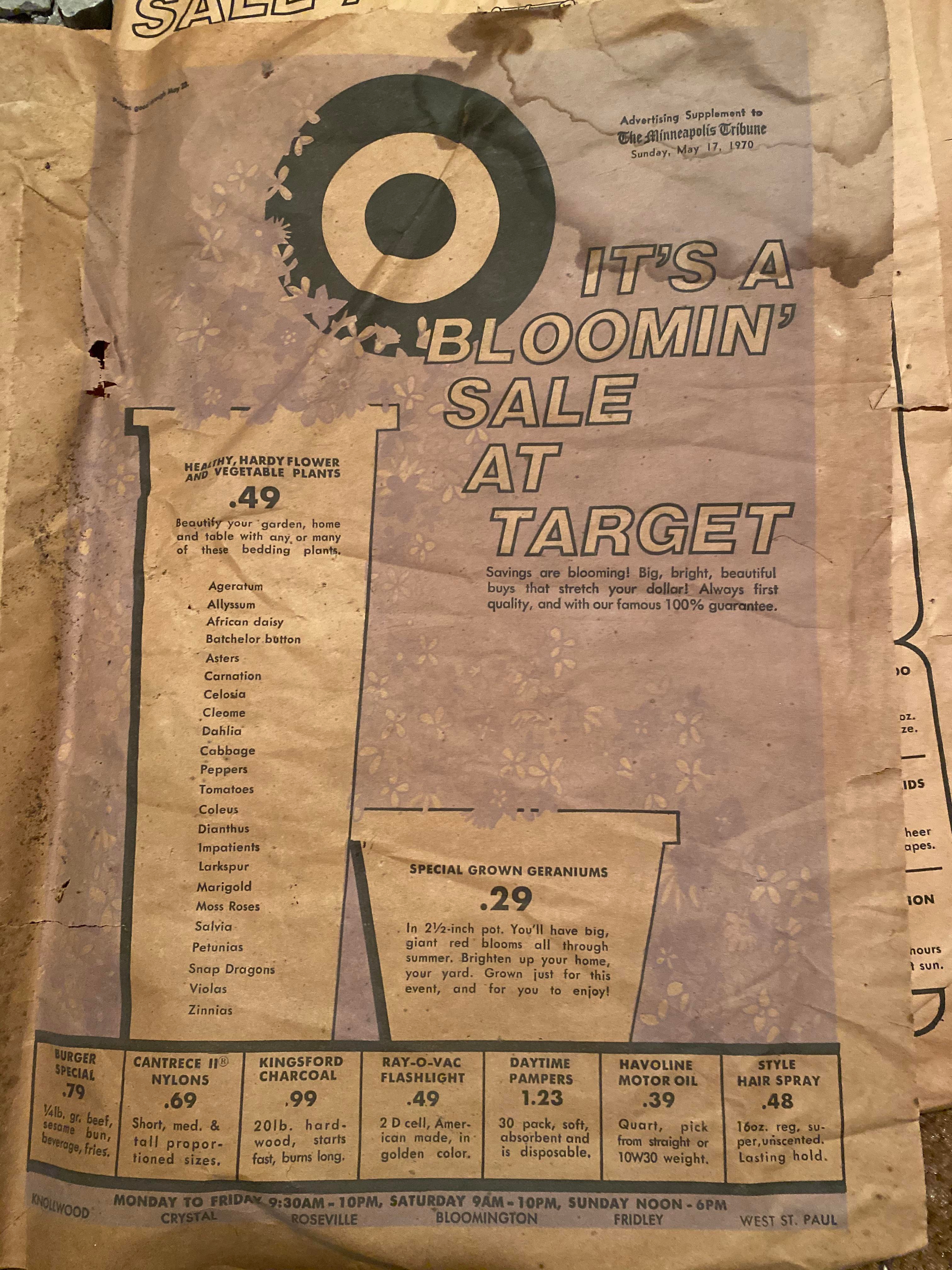 A vintage Target advertisement  features a works  merchantability  with hardy flowers and geraniums, alongside promotions for items similar  batteries and hairspray