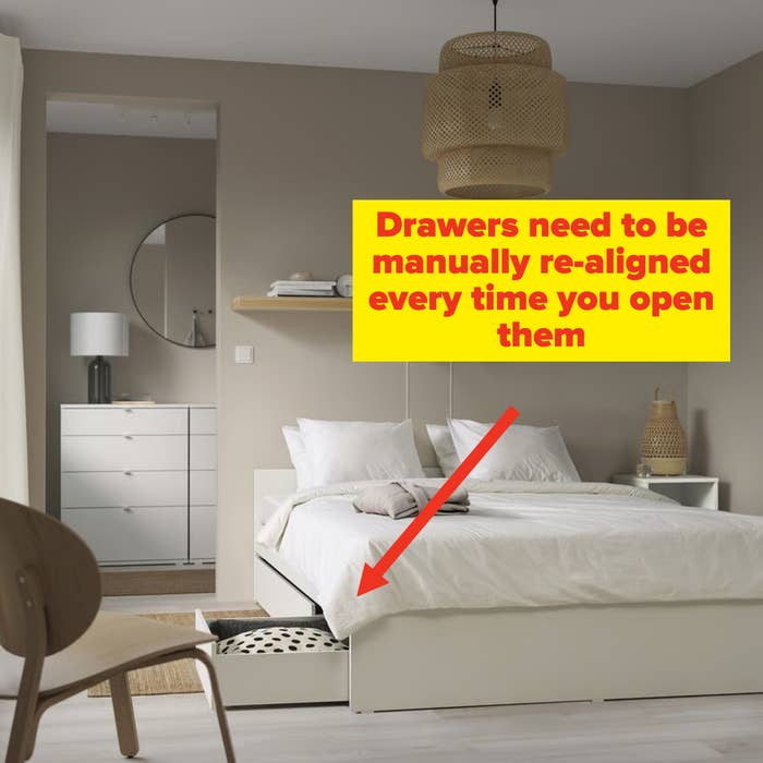 Minimalist chamber  with a bed, shelf, and lamp. A wicker pendant airy  hangs from the ceiling. There's a mirrored dresser successful  the background