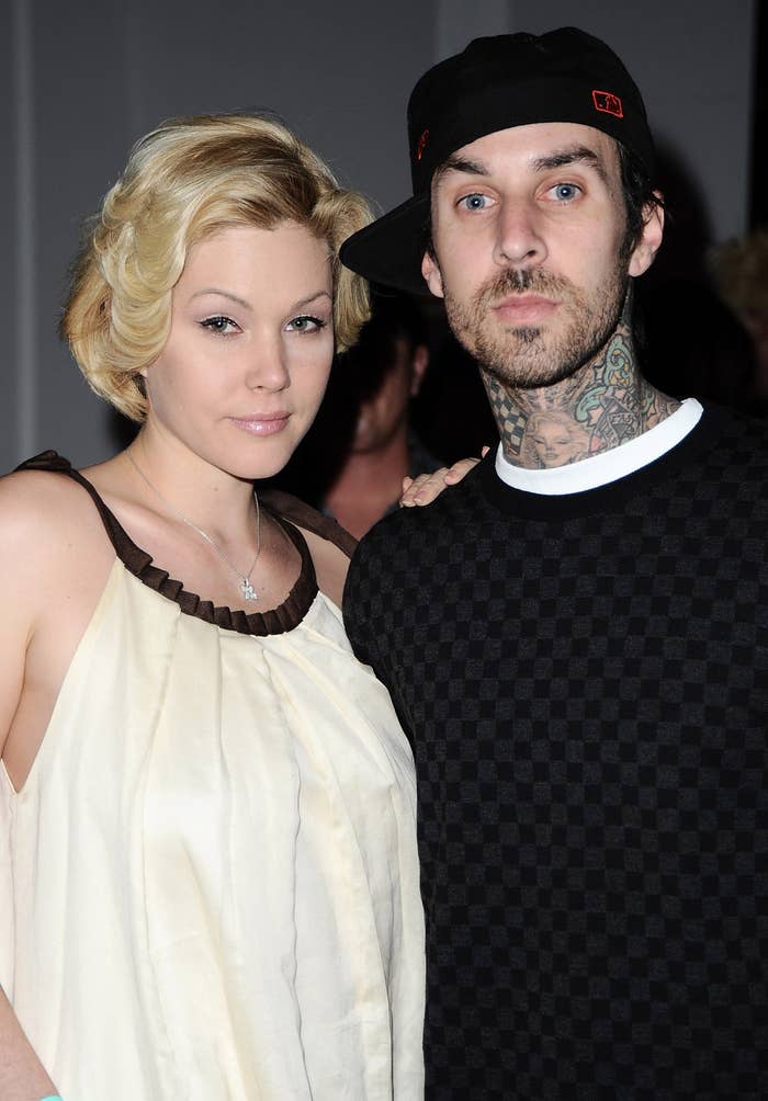 Shanna Moakler and Travis Barker posing together