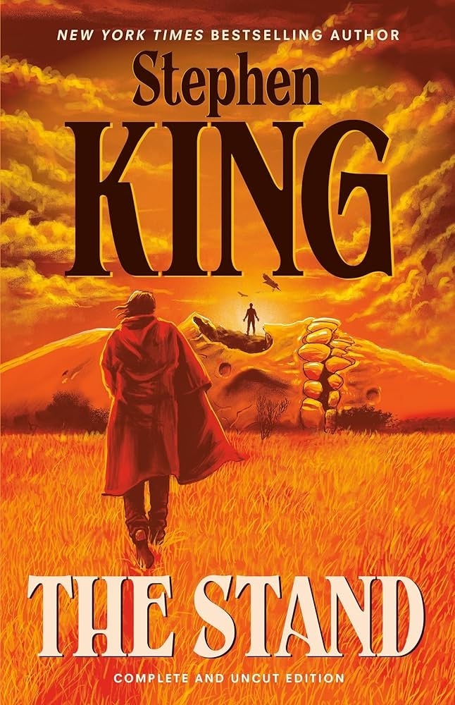 Book cover of Stephen King's "The Stand: Complete and Uncut Edition" featuring a figure walking in a vast field with ominous skies