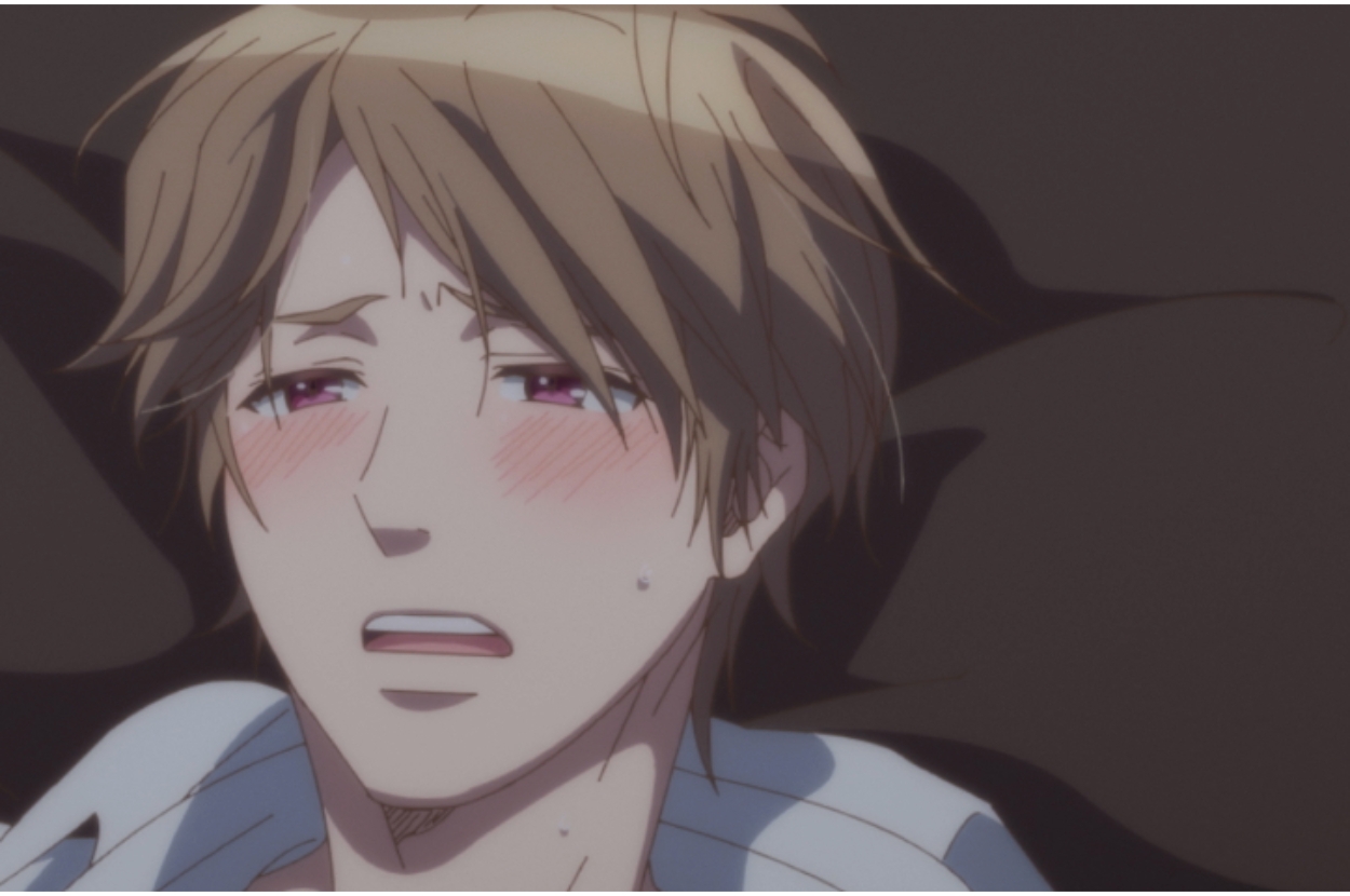 Anime character with flushed cheeks looks distressed, lying down, eyes closed, mouth open in a pained expression