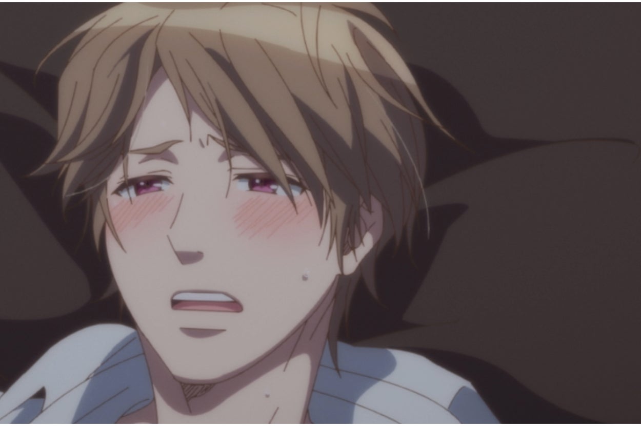 Anime character with flushed cheeks looks distressed, lying down, eyes closed, mouth open in a pained expression