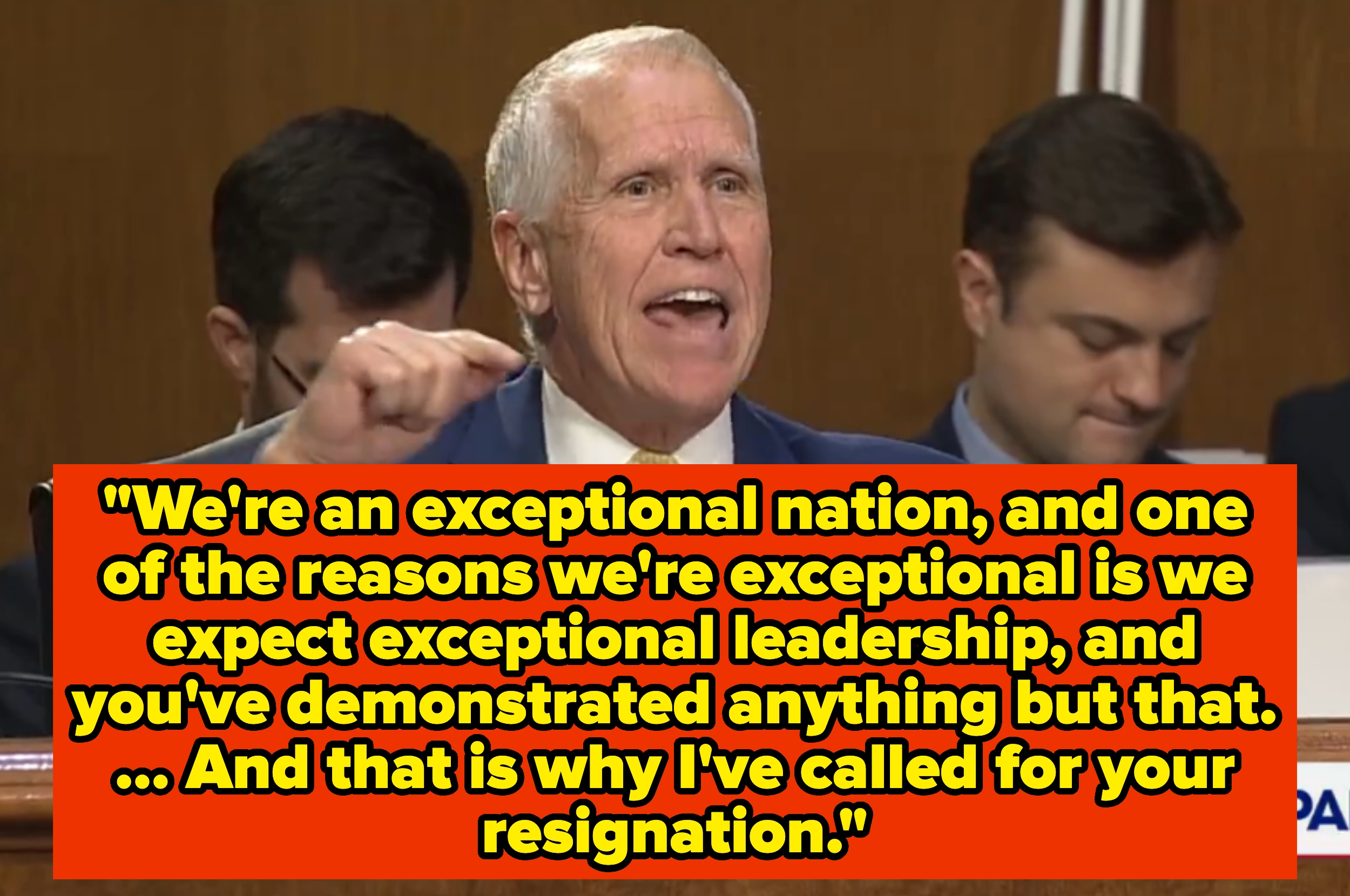 A idiosyncratic passionately speaks astatine a podium with substance overlay calling for a leader's resignation owed to mediocre leadership