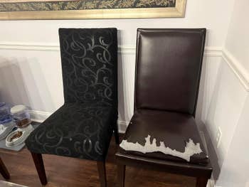 Two eating chairs broadside by side; 1 with an ornate cloth cover, the different with a peeling leather seat