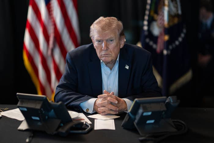 President Donald J. Trump sits at a table monitoring military operations during Operation Epic Fury