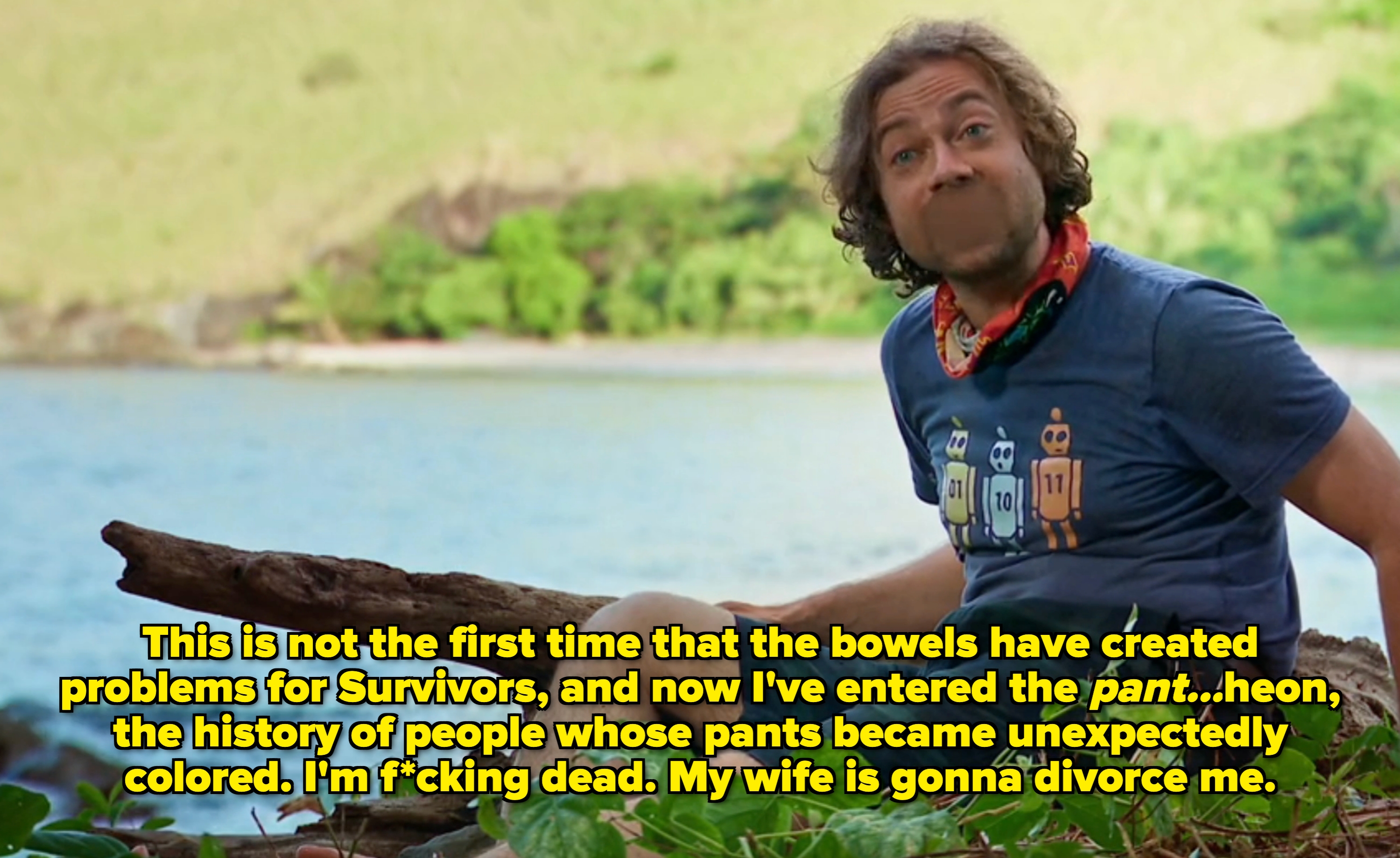 A idiosyncratic   sitting connected  a log by a lake, wearing a casual T-shirt and shorts, with a bandana astir   their neck. Lush greenery successful  the background