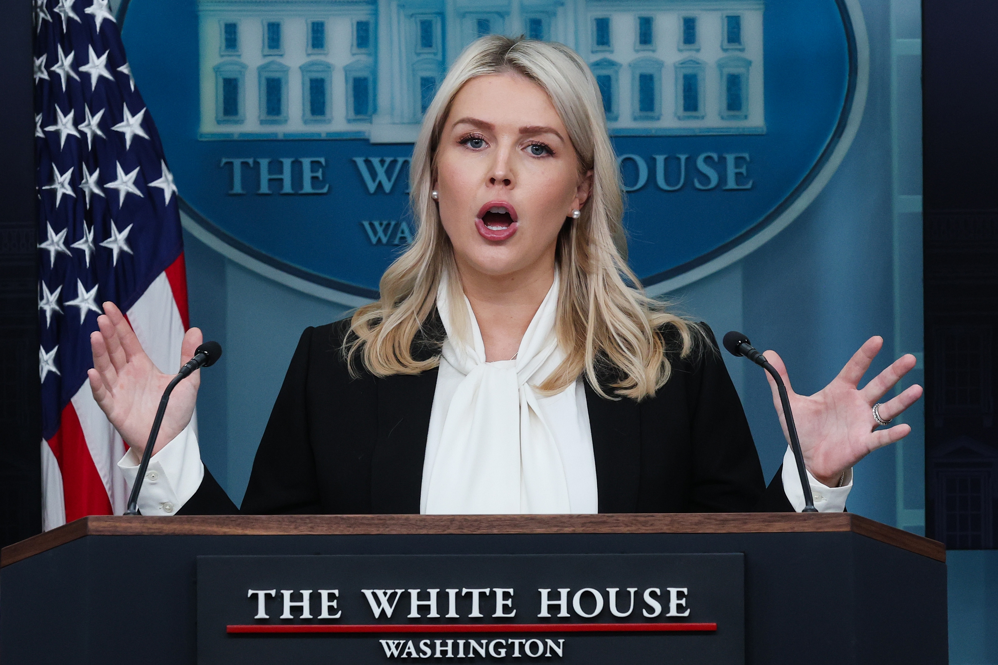 Person speaking astatine  a White House podium with microphones, gesturing with some  hands, successful  a nonrecreational  setting