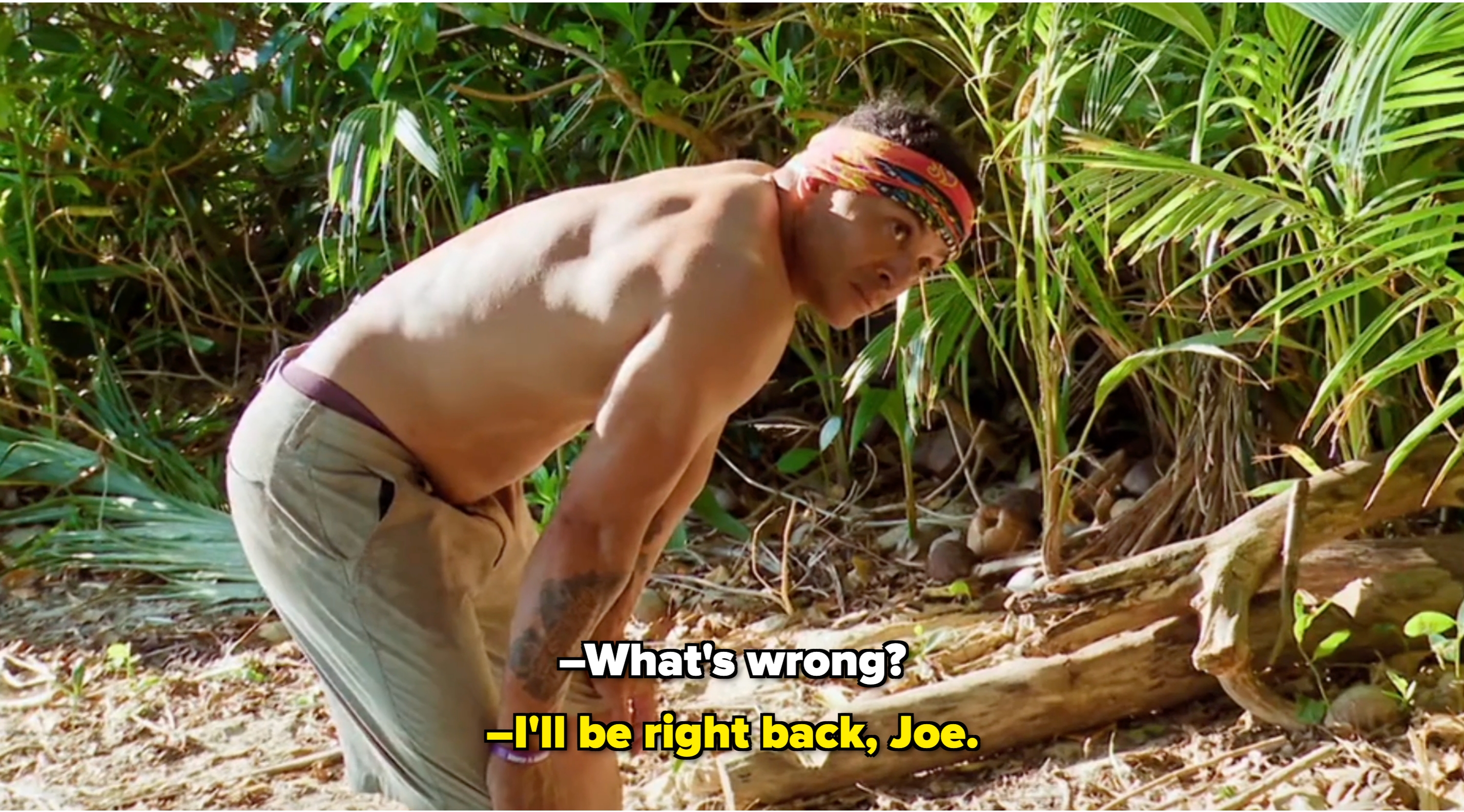 A idiosyncratic   outdoors wearing a printed T-shirt and patterned headband, lasting  adjacent   trees