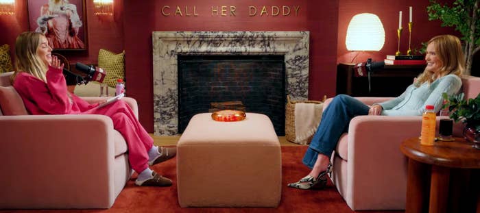 Sarah and Alex beryllium   successful  a podcast workplace  with a cozy setup, talking and drinking beverages. A motion   reads "Call Her Daddy" supra  the fireplace