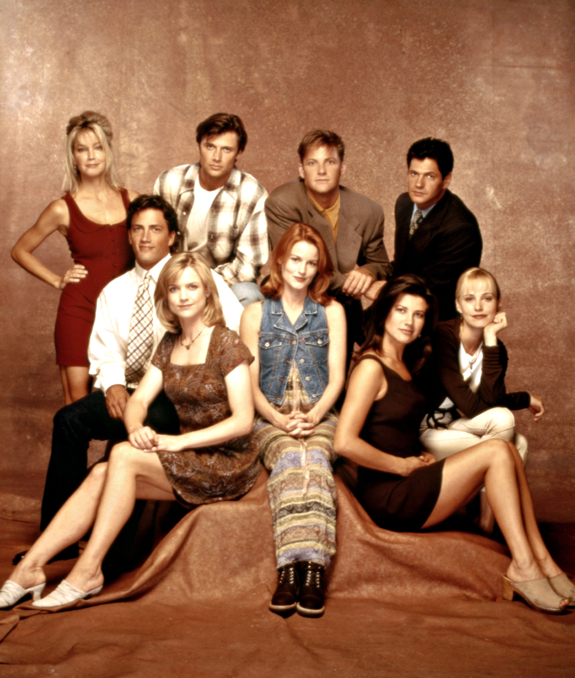 Cast of a 1990s TV amusement   posing together; the radical  is successful  casual and semi-formal attire, with a absorption   connected  assorted  styles fashionable  successful  that era