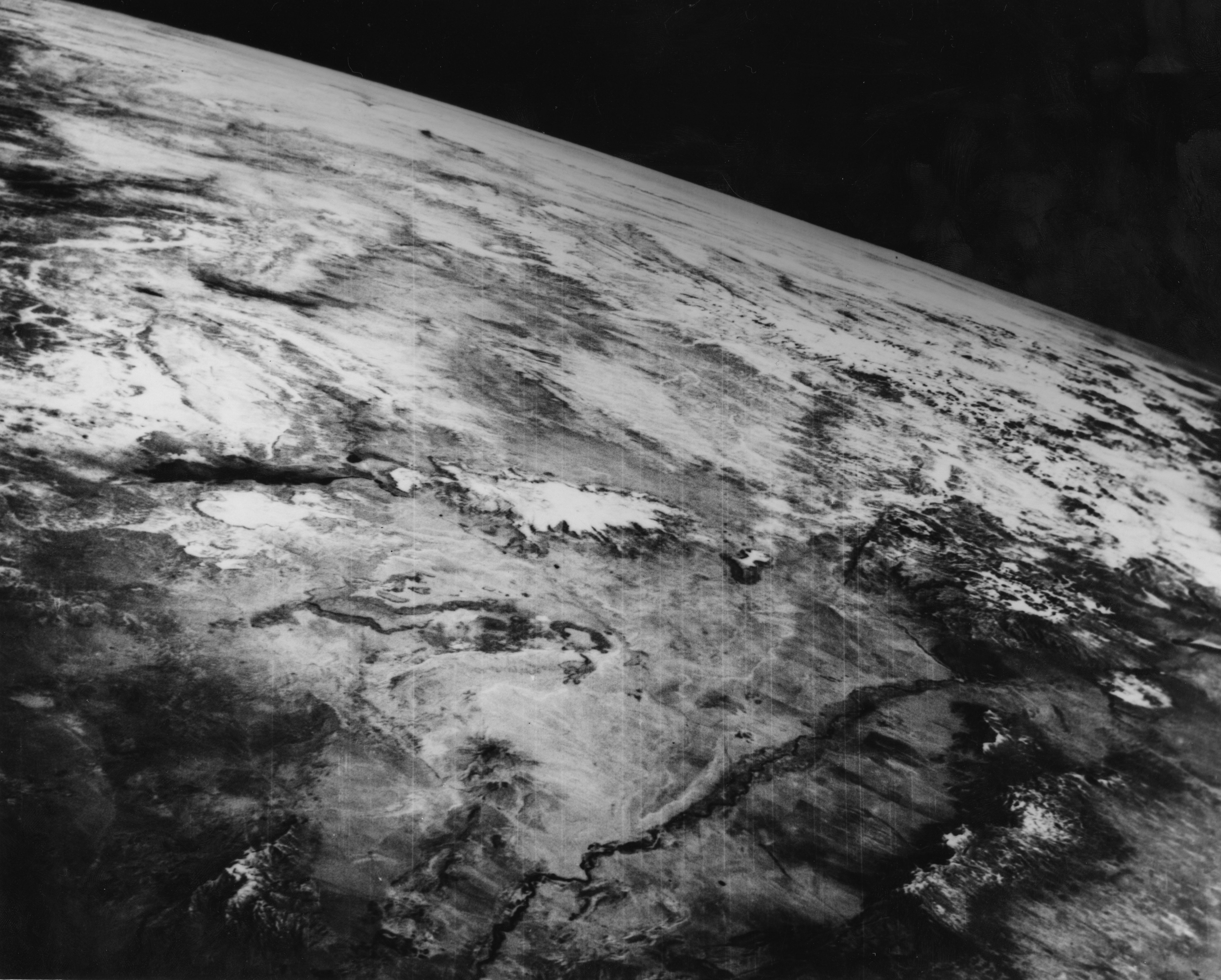 Satellite presumption    of Earth's surface, showing varied terrain and unreality  cover. The representation  highlights Earth's earthy  landscapes from space