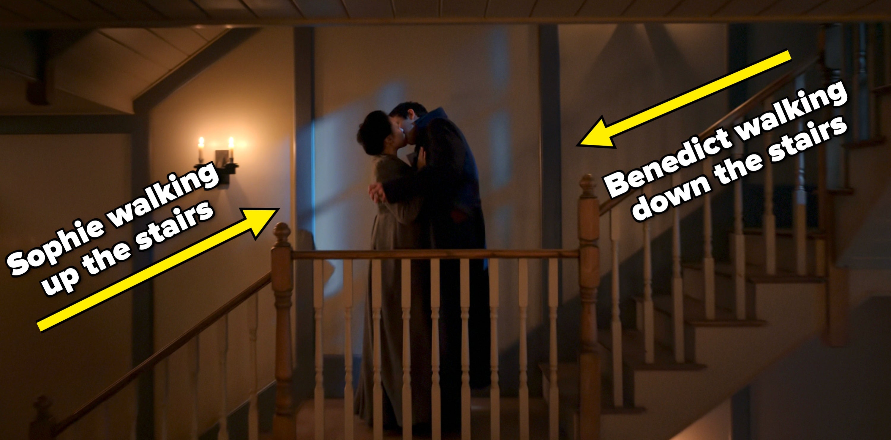 A couple shares a romantic kiss on a dimly lit staircase, with shadows cast on the wall