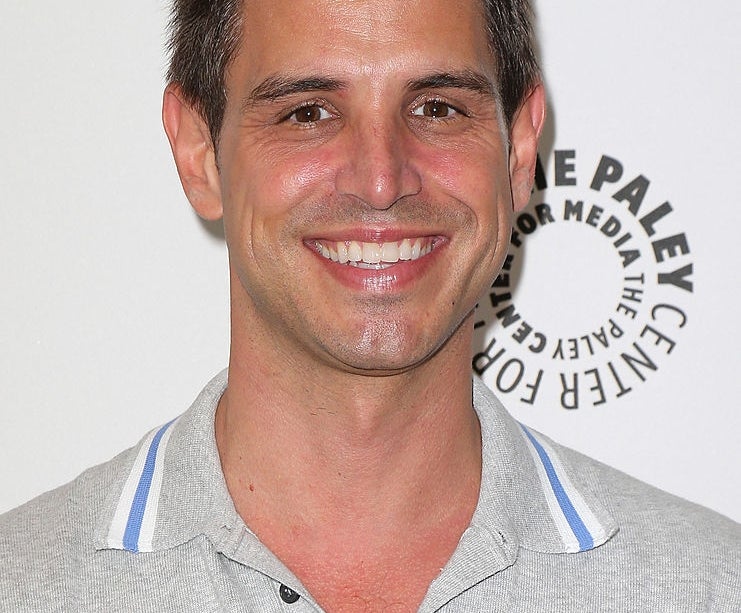 Smiling antheral   successful  a collared garment  stands successful  beforehand   of a Paley Center for Media backdrop