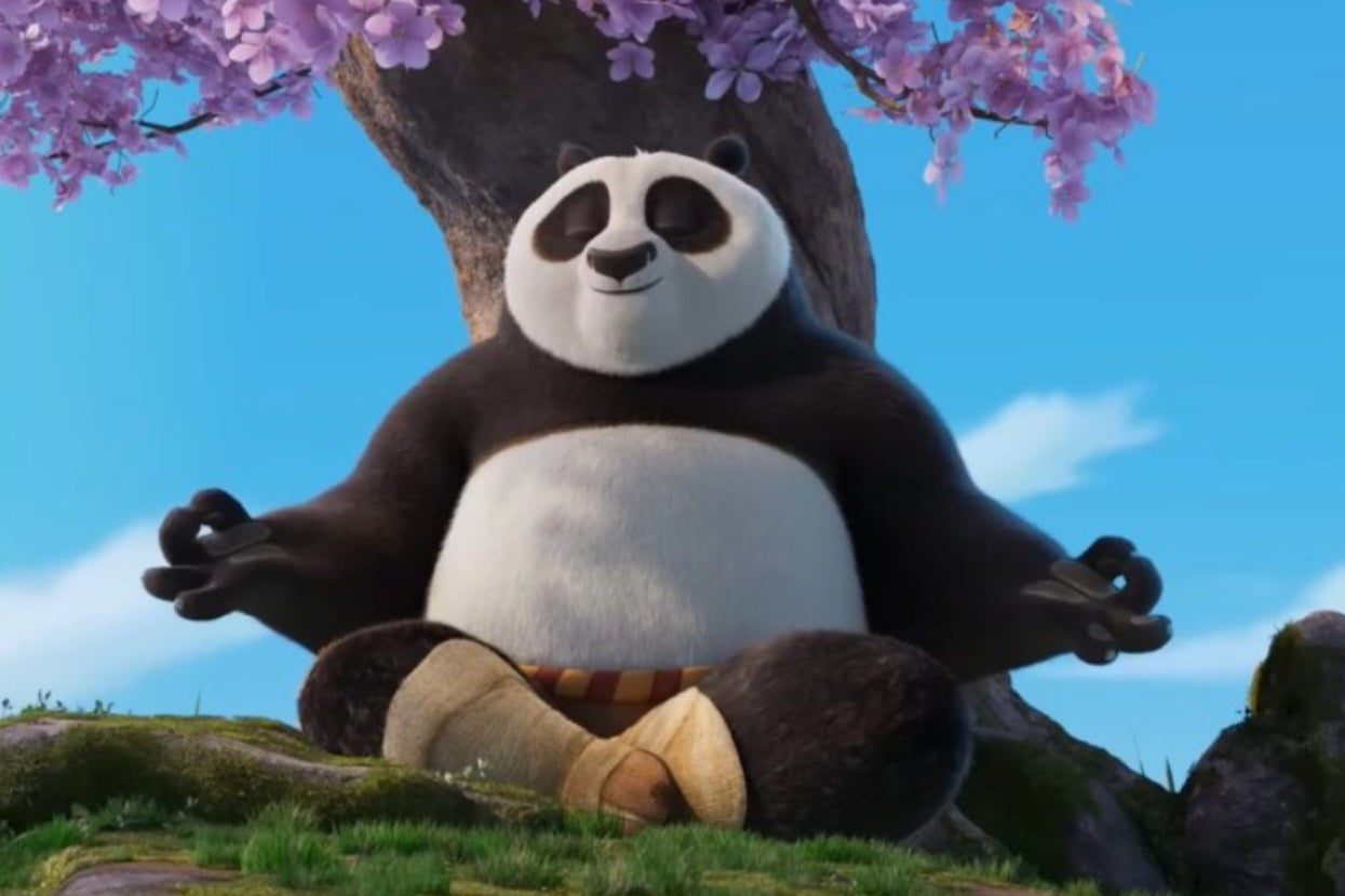 Animated panda meditates under a tree with pink blossoms, sitting cross-legged and smiling peacefully in a serene outdoor setting