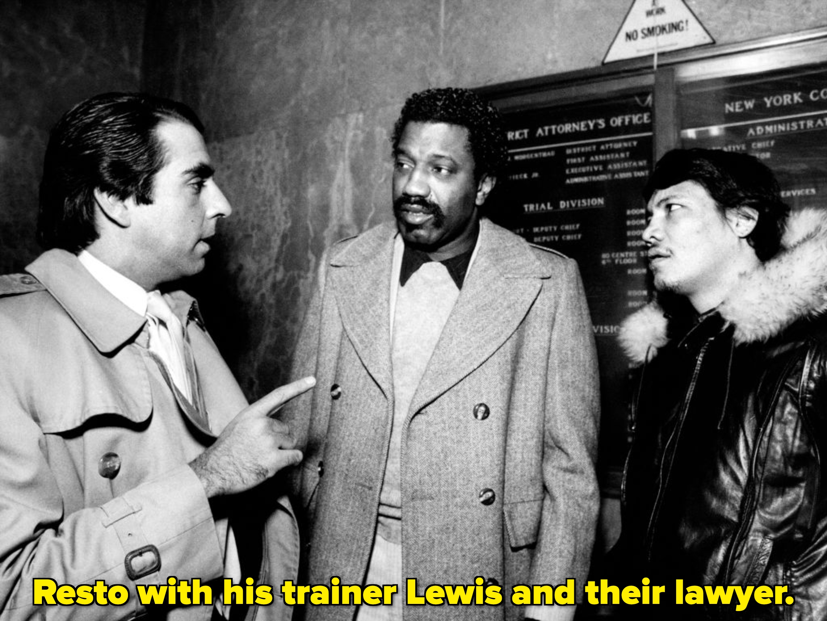 Three men are engaged successful  speech  indoors. The antheral   successful  the halfway  wears a ceremonial  coat