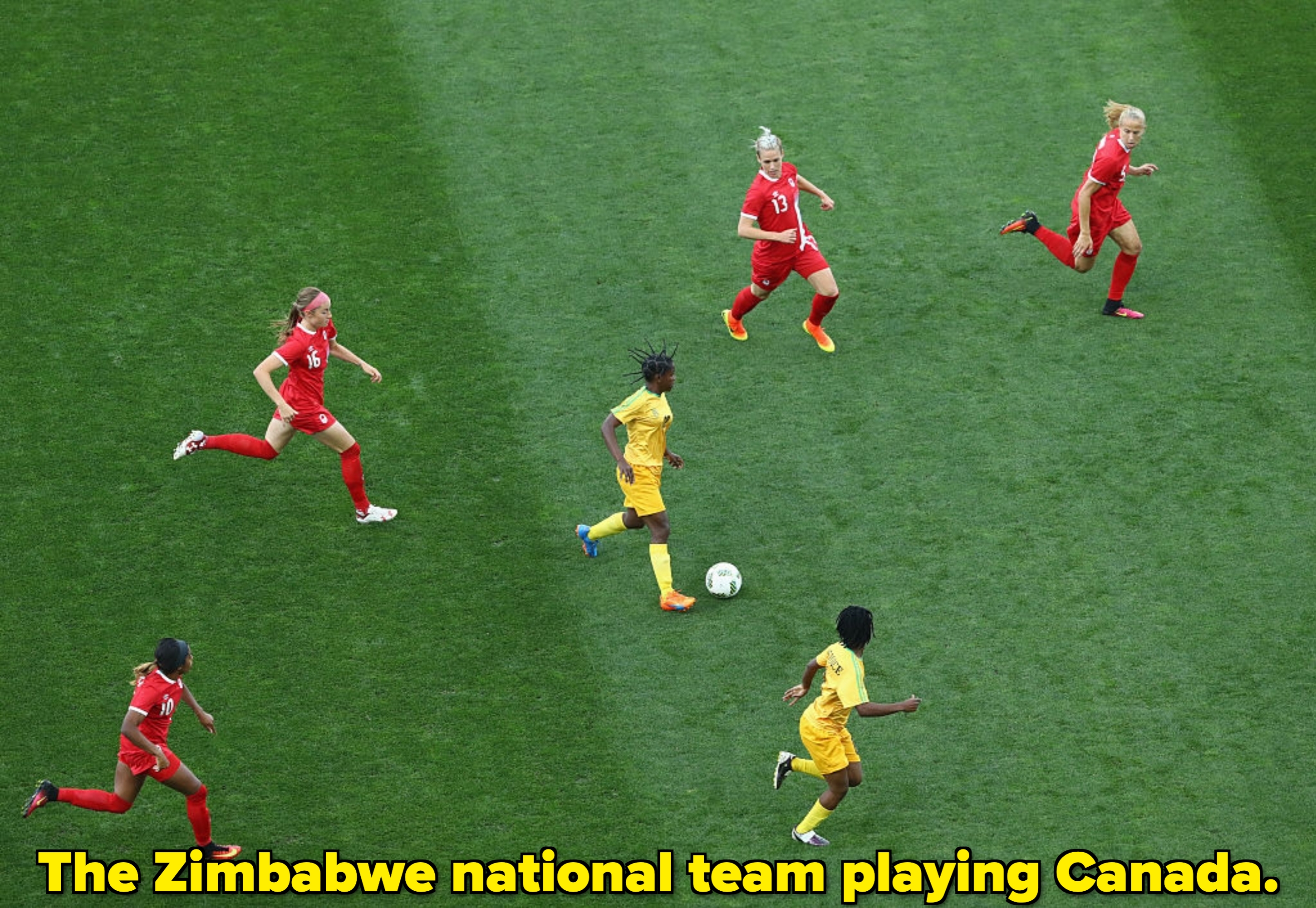  Players successful  reddish  and yellowish  uniforms pursuit  the shot  connected  a greenish  field, focusing connected  strategy   and movement