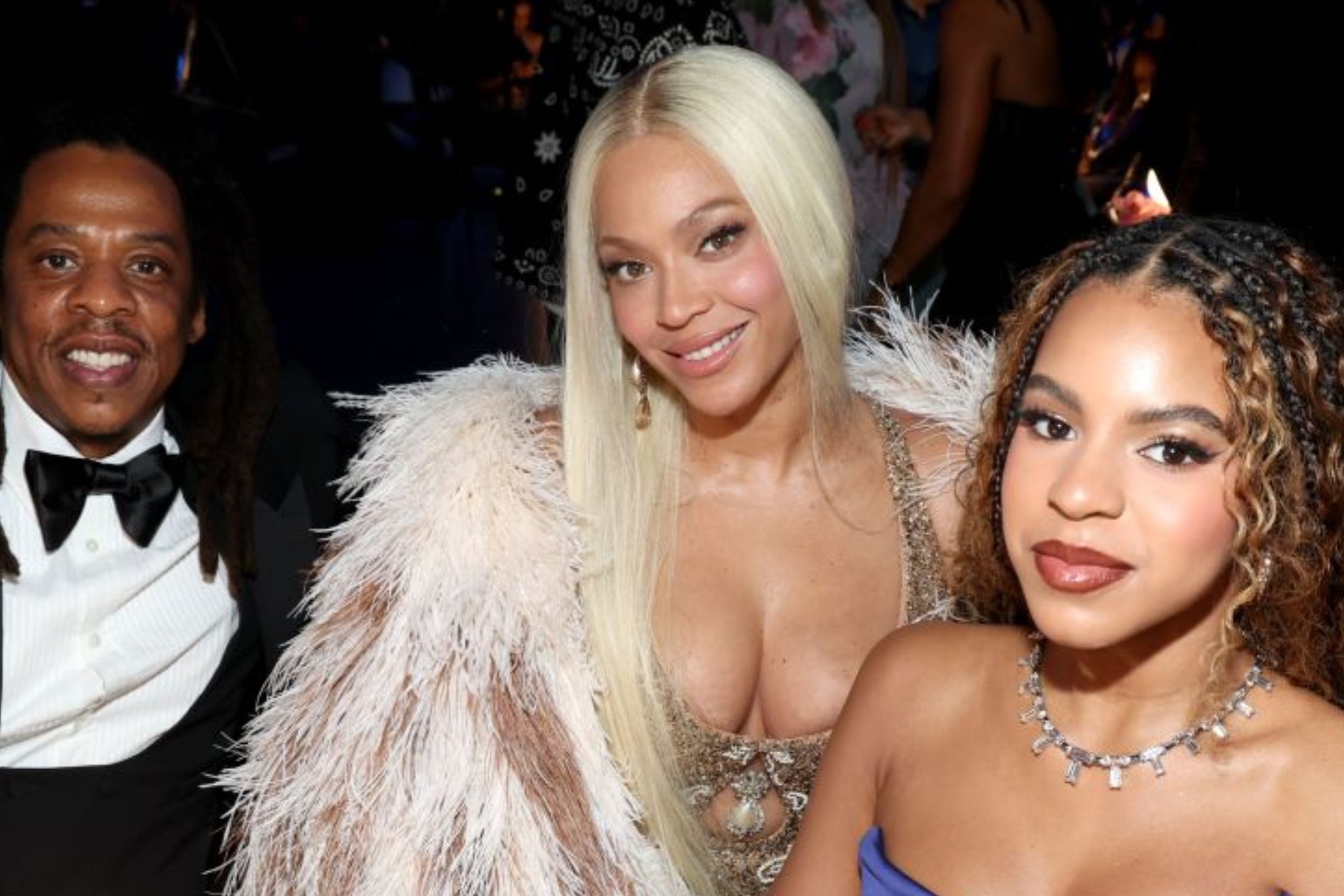 I don't know who they are. Three people at an event, with one in a feathered gown and another in a strapless dress. They are smiling at the camera