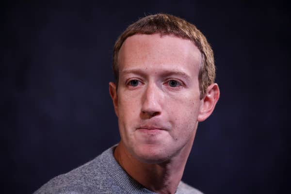 Mark Zuckerberg in a casual sweater looking slightly to the side against a plain background