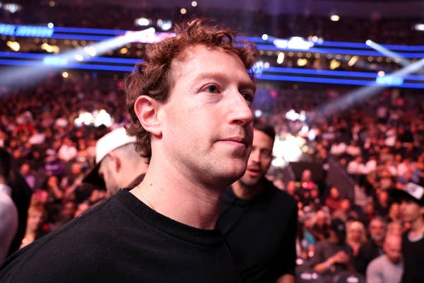 Mark Zuckerberg attending a crowded UFC fight, wearing a casual shirt, with soft lighting and blurred audience in the background