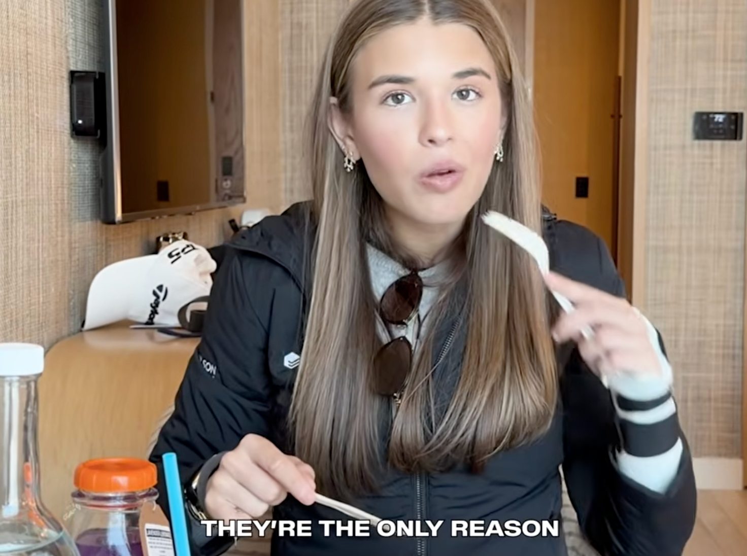 Person eating astatine  a table, holding cutlery, with sunglasses astir   their neck. Text reads, "They're the lone  reason."