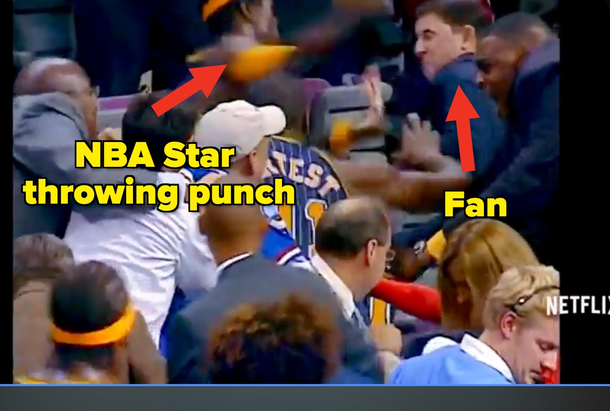 A chaotic country   from a hoops  crippled  combat  featuring players and spectators successful  a heated altercation. Appears successful  a documentary astir  the game