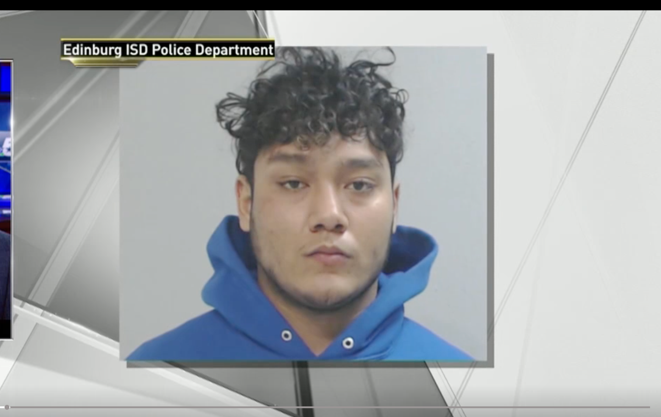 A constabulary  section  mugshot of a idiosyncratic   with curly hairsbreadth  wearing a hooded sweatshirt. The representation  is associated with a sports article