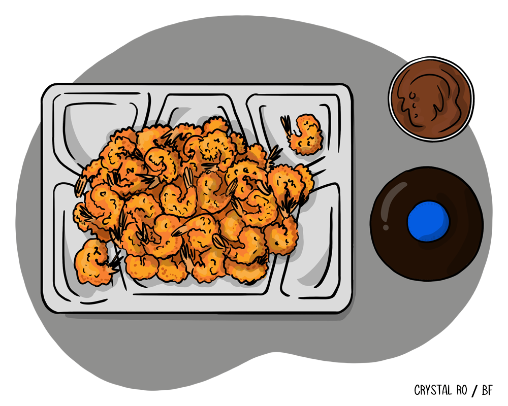Plate of fried shrimp next to two dipping sauces