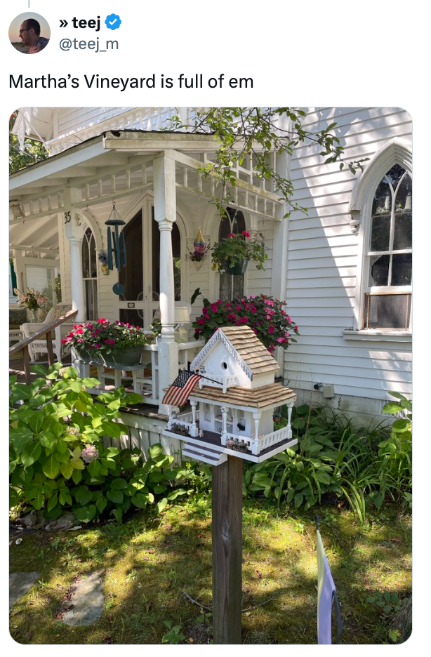 House with ornate, achromatic  woody  facade and tiny  replica operation   successful  yard. The substance   reads, "Martha's Vineyard is afloat  of em."