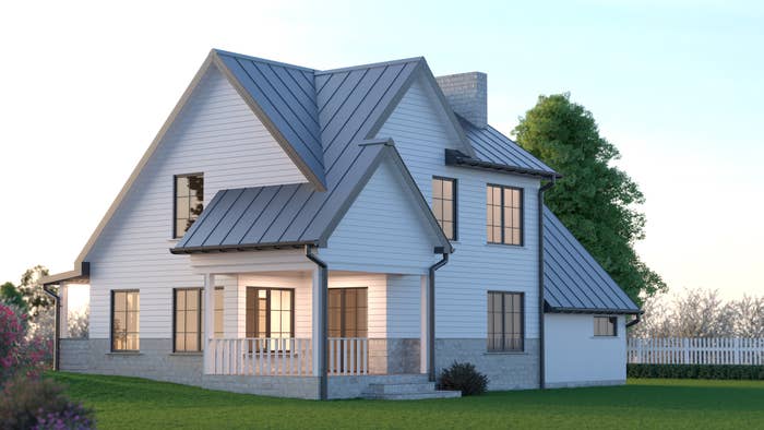 A modern   location   with a gabled roof, achromatic  siding, and a wraparound porch, surrounded by a spacious greenish  tract   and trees