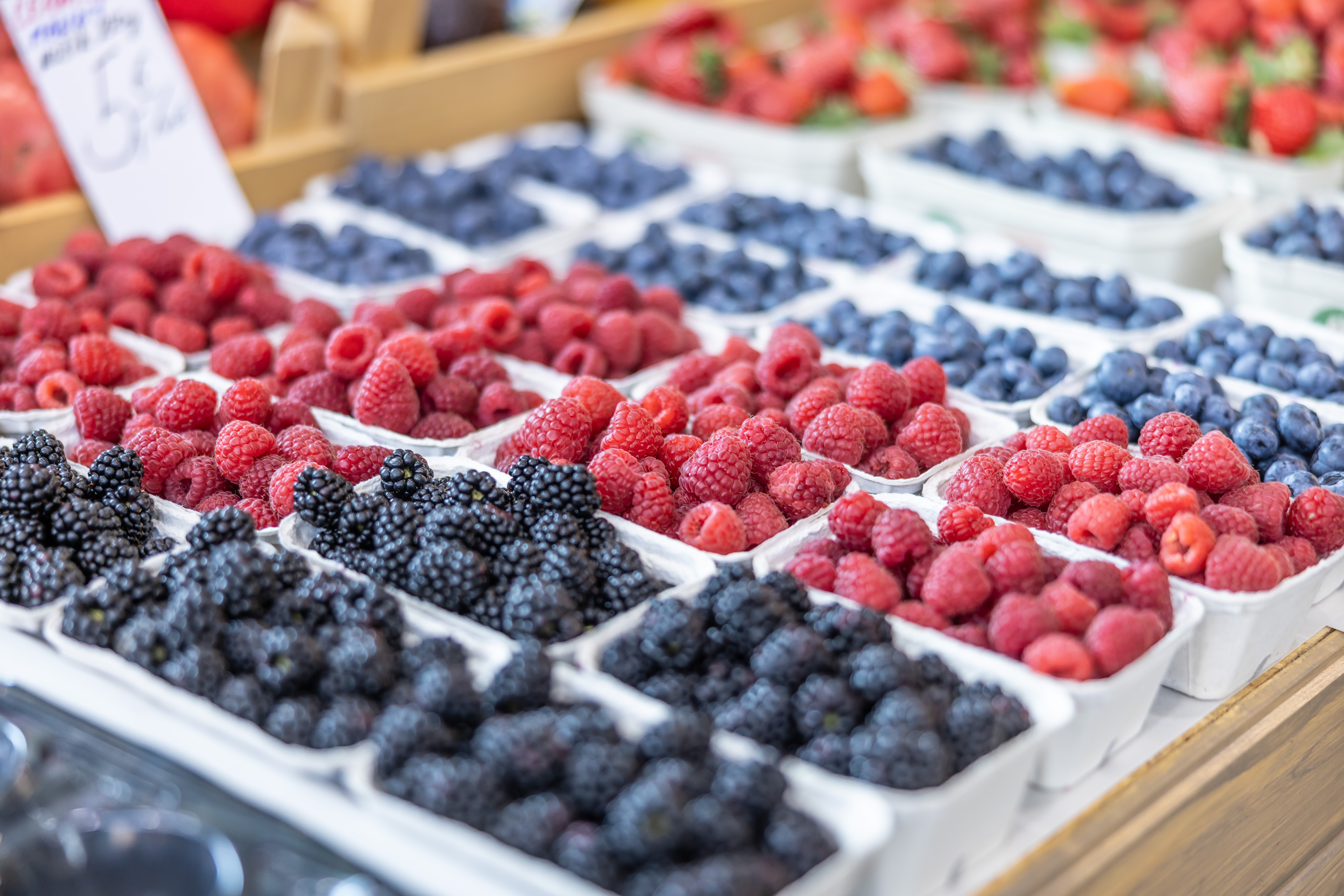 Assorted berries, including raspberries, blackberries, and blueberries, connected  display