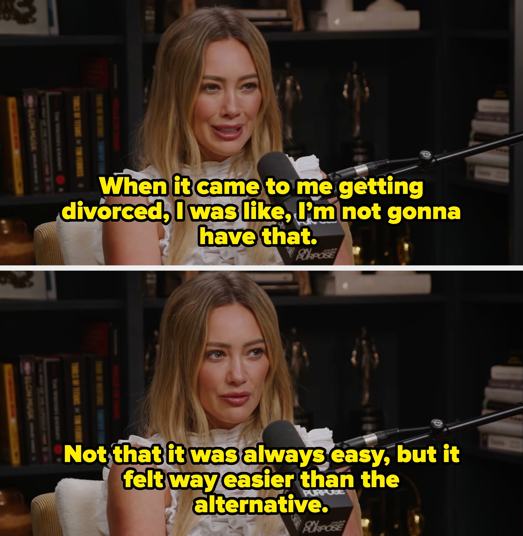 Person speaking into a microphone during a podcast, wearing a white ruffled top, with books and trophies in the background